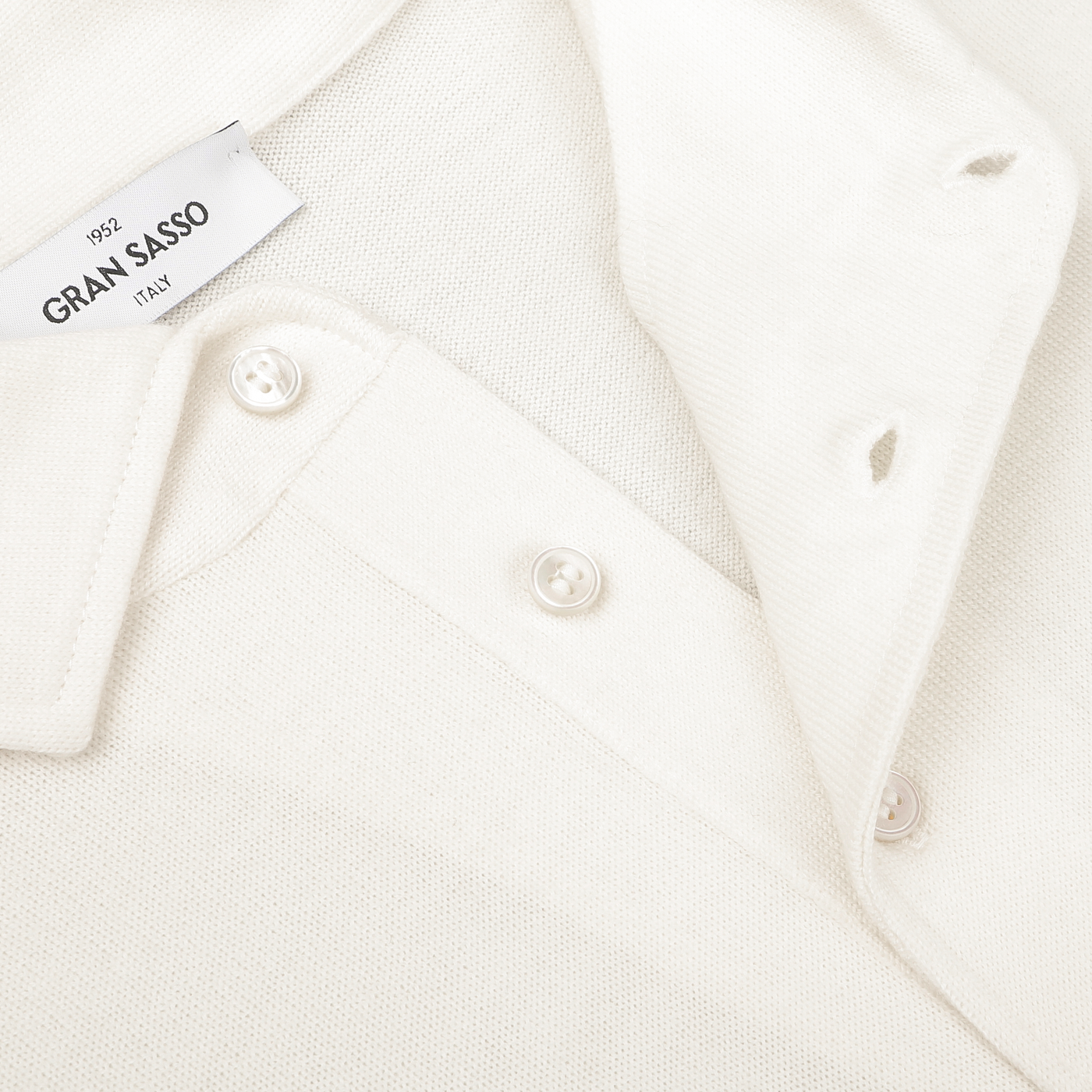 A close-up image of the Gran Sasso Ivory Merino Wool One-Piece Collar Polo Shirt, highlighting its buttons and collar.