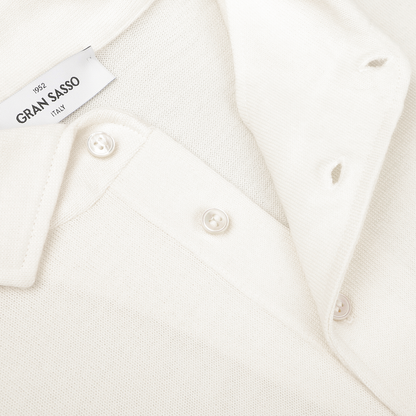 A close-up image of the Gran Sasso Ivory Merino Wool One-Piece Collar Polo Shirt, highlighting its buttons and collar.