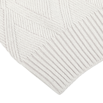 Close-up of the Light Grey Wool Cashmere Diamond Knit Sweater by Gran Sasso, featuring a geometric pattern and ribbed edges that exemplify the exquisite quality of Italian knitwear.