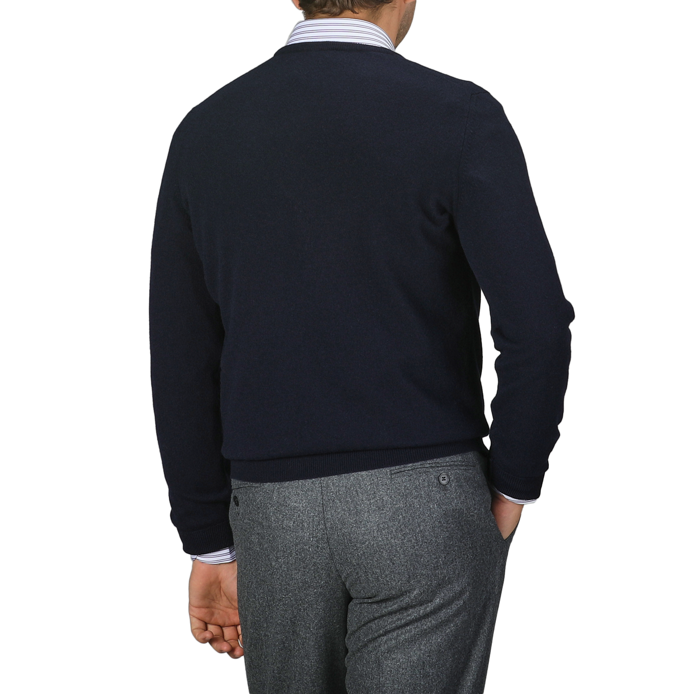 A person in a Navy Blue Cashmere Crew Neck Sweater by Gran Sasso and gray trousers is facing away, highlighting the back of this stylish outfit against a plain background.