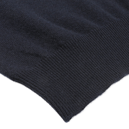 Close-up of the edge of Gran Sasso's Navy Blue Cashmere Crew Neck Sweater, crafted from luxurious cashmere fibers, showcasing the garment's fine ribbing detail.