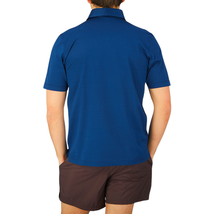 The back view of a man wearing a Gran Sasso Navy Blue Cotton Filo Scozia Polo Shirt.