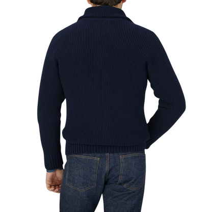 The back view of a man wearing a Gran Sasso Navy Blue Eco Cashmere Funnel Neck Cardigan.