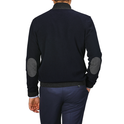 A person wearing a Gran Sasso Navy Blue Wool Cashmere Zip Cardigan, potentially layered over premium knitwear, is seen from the back against a plain background.