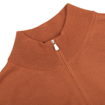 Close-up of a Gran Sasso zip cardigan in sienna brown, expertly crafted from extrafine merino wool, showcasing a partially closed visible zipper at the collar.