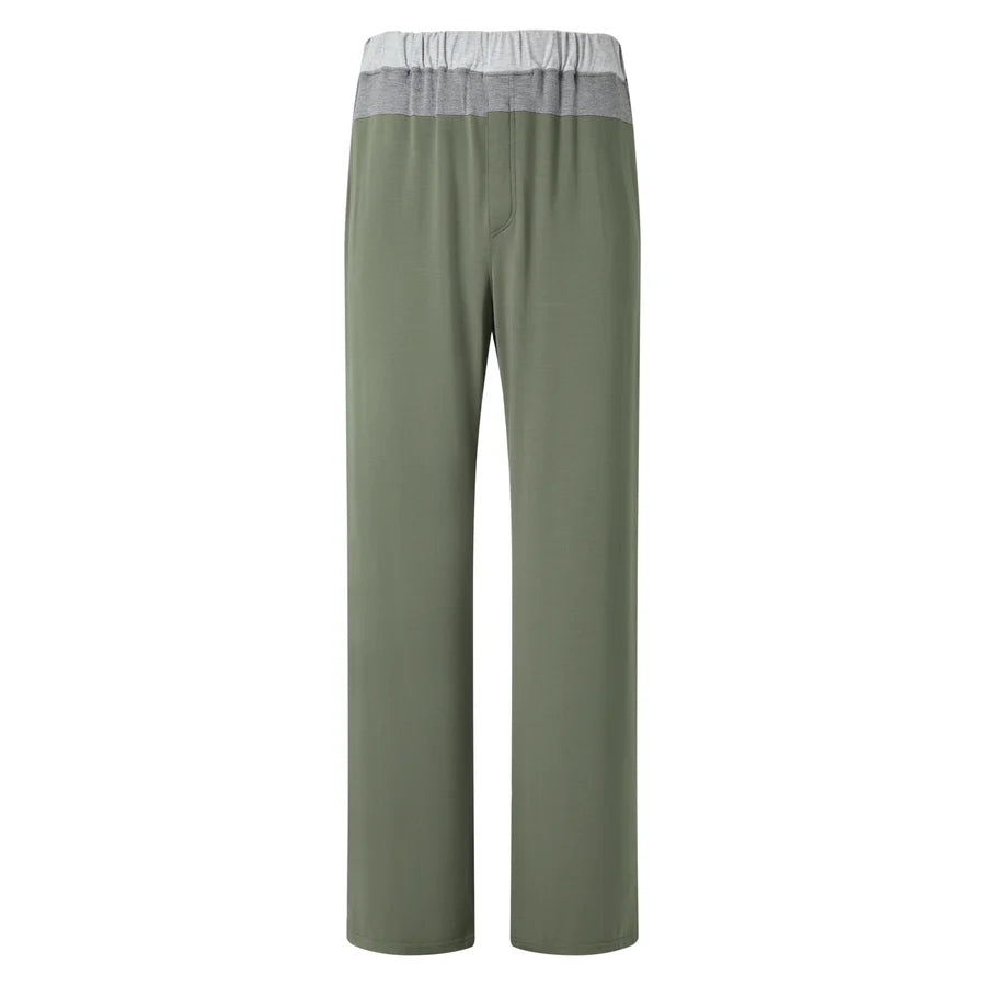 The Homebody Charred Green Modal Duo Trousers are straight-leg lounge pants in olive green with a wide color-blocked waistband, made from breathable Modal Sens fabric, relaxed fit, and no visible pockets or drawstring, shown on a white background. , available at Richard Gelding Mayfair