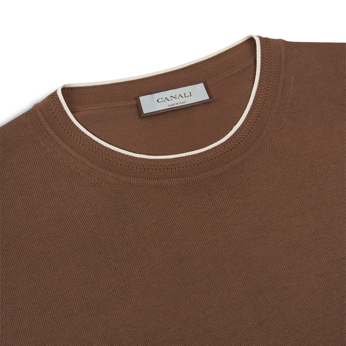 A close-up of a brown Canali Giza Cotton T-shirt with white contrast piping along the neckline. The texture and a Canali label at the inside back, showing "Canali" and "Made in Italy," are visible. , available at Richard Gelding Mayfair