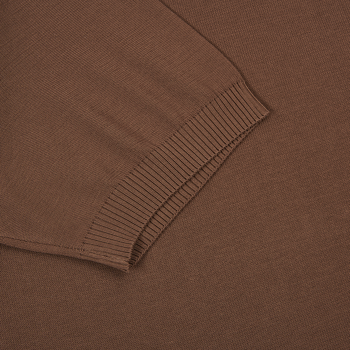 Close-up of the Canali Brown Giza Cotton T-shirt with contrast piping, showing the ribbed cuff against matching fabric. The texture and weave stand out, highlighting the contrast between ribbed and smooth sections. , available at Richard Gelding Mayfair