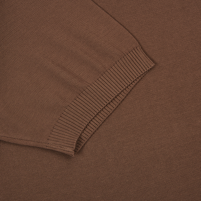 Close-up of the Canali Brown Giza Cotton T-shirt with contrast piping, showing the ribbed cuff against matching fabric. The texture and weave stand out, highlighting the contrast between ribbed and smooth sections. , available at Richard Gelding Mayfair