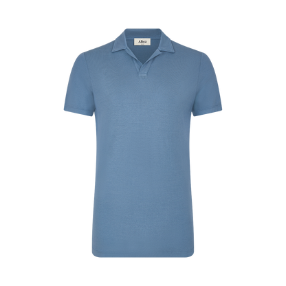 The Altea Blue Ice Cotton Polo, a classic short-sleeved shirt with a relaxed collar and no buttons, is displayed on a plain white background with the Altea label visible inside the neckline. , available at Richard Gelding Mayfair