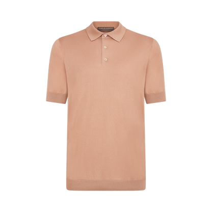 The Filippo de Laurentiis Peach Sea Island Cotton Polo Shirt features short sleeves, a ribbed collar and cuffs, and two pearlescent buttons at the placket, crafted from luxurious cotton. , available at Richard Gelding Mayfair