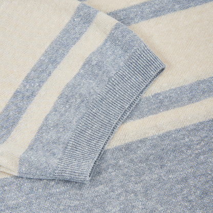 A close-up of the Gran Sasso Grey Stripe Cotton/Linen Knitted T-shirt highlights its soft textured fabric and pale blue and cream stripes—ideal inspiration for a men's breathable shirt. , available at Richard Gelding Mayfair