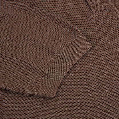 Close-up of the Gran Sasso Brown Silk Pique Short Sleeve Polo, showing its fine waffle-like knit texture and rich medium brown color. The detailed silk pique fabric highlights the brand’s craftsmanship and luxurious feel. , available at Richard Gelding Mayfair