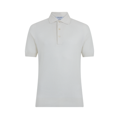 The Gran Sasso White Silk Pique Polo features short sleeves, a classic collar, ribbed hem and cuffs, and a three-button placket. It is shown against a plain white background. , available at Richard Gelding Mayfair