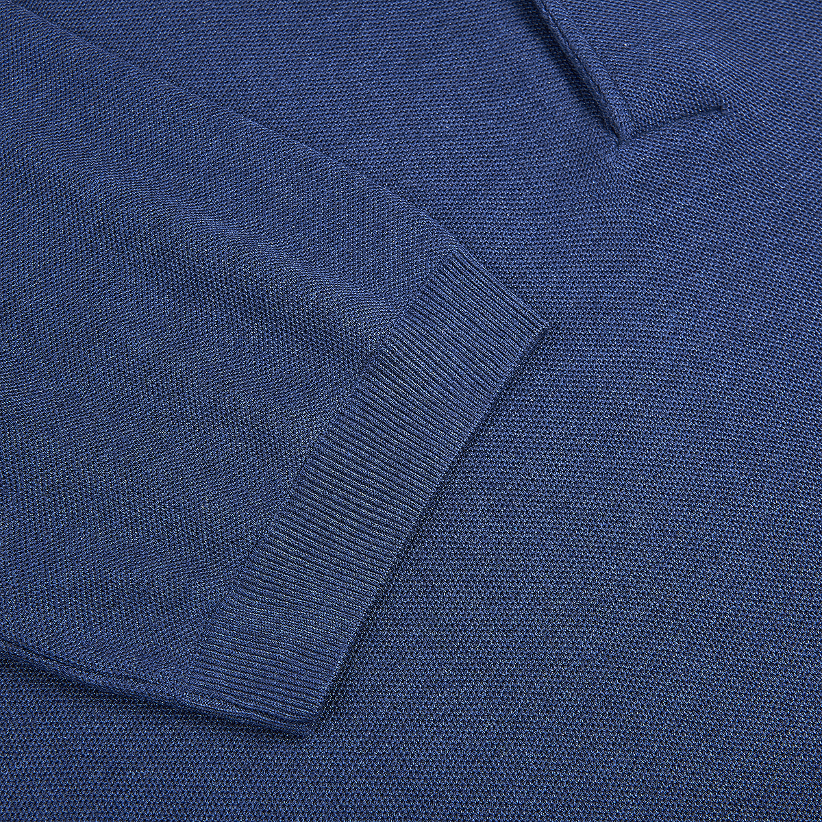 Close-up of a Gran Sasso Navy Blue Silk Pique Polo, highlighting the textured fine-knit pattern and ribbed cuff contrasting with the smoother main fabric, all in a rich, deep navy blue. , available at Richard Gelding Mayfair