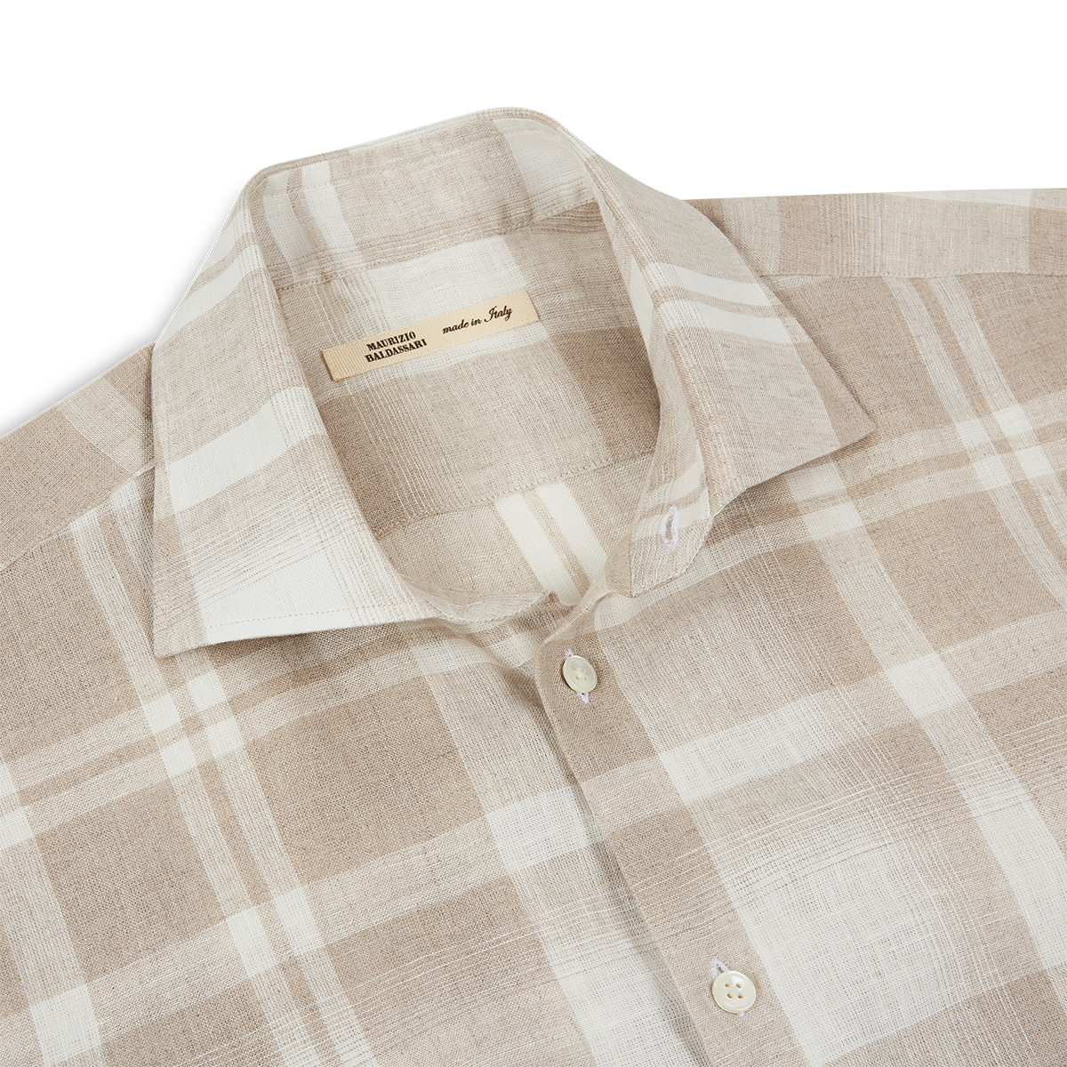 The Maurizio Baldassari Light Brown Linen Check Short Sleeve Shirt is shown laid flat. It features a spread collar, a subtle textured pattern, two front placket buttons, and a tag inside the collar reading “made in Italy.”. , available at Richard Gelding Mayfair
