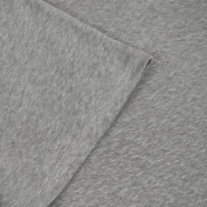 Close-up of the soft, heather gray fabric and seam on the Paige Light Grey Linen Capri Collar Polo Shirt. Its smooth, breathable texture ensures comfort, ideal for a stylish summer look. , available at Richard Gelding Mayfair