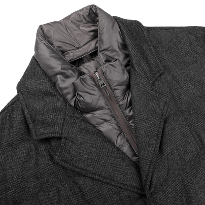 A charcoal checked wool cashmere jacket by Herno, featuring a segmented gray hooded inner lining and a Rain System zip-up closure beneath the collar.