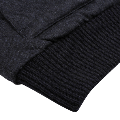 Close-up of a dark knit cuff and textured fabric on the Herno Navy Blue Cashmere Silk Bomber Jacket, showcasing intricate stitching details.
