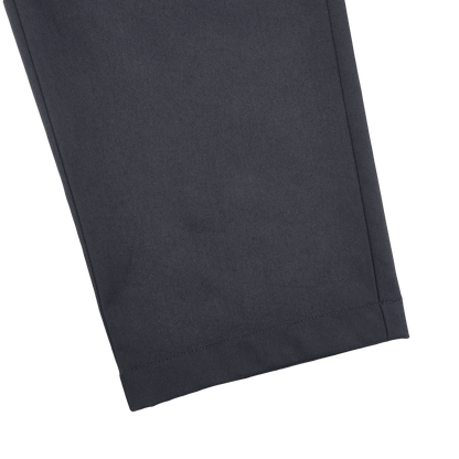 Close-up of a slim fit pant leg from Herno's Navy Blue Nylon Stretch Drawstring Trousers, featuring a straight hemline against a plain background.