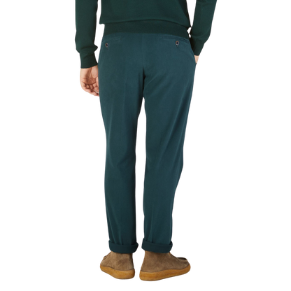 The back view of a man wearing Hiltl's Airforce Blue Cotton Stretch Regular Fit Chinos.