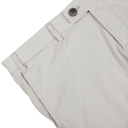 Close-up view of a Hiltl Cream Beige Cotton Nylon Slim Chinos waistband with button closure.