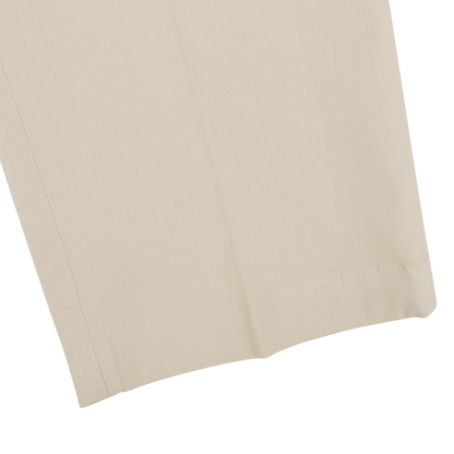 Close-up of the bottom hem of Hiltl's Khaki Cotton Stretch Regular Fit Chinos, highlighting the stitching detail and fabric texture crafted from pure cotton twill.