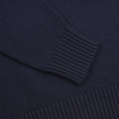 Close-up of the Maurizio Baldassari Navy Wool/Cashmere Blend Open Turtle Neck Sweater highlighting its long sleeve and bottom hem with thick, ribbed knit details contrasting the finer, smooth-knit body. , available at Richard Gelding Mayfair