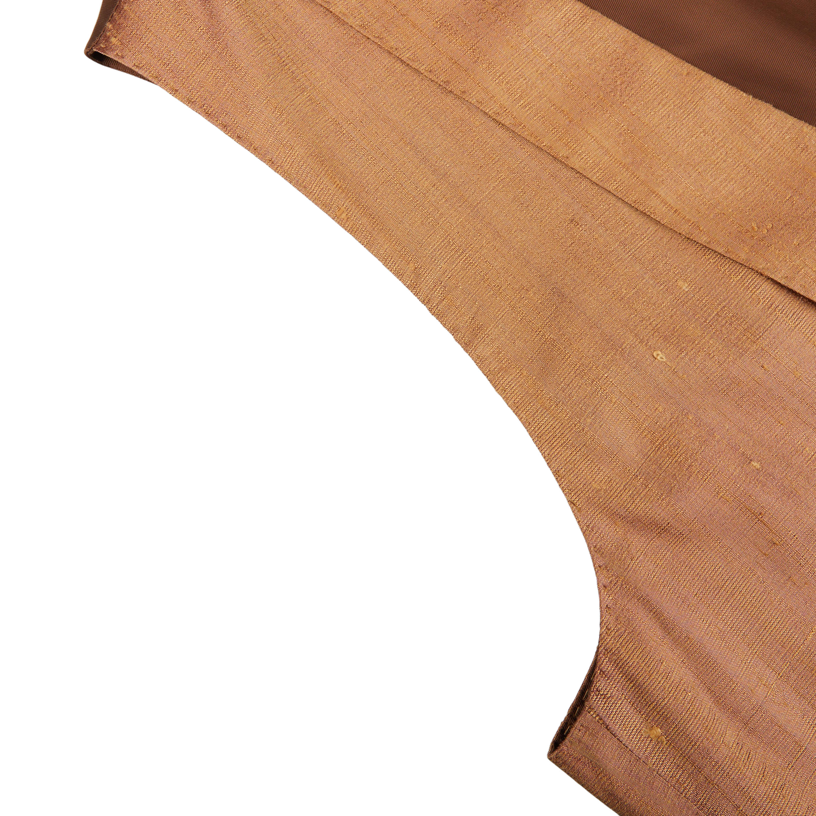 Close-up of a folded, textured fabric on a white background, showcasing its weave and hem, reminiscent of the luxurious feel of Lardini's Bronze Pure Silk DB Waistcoat.