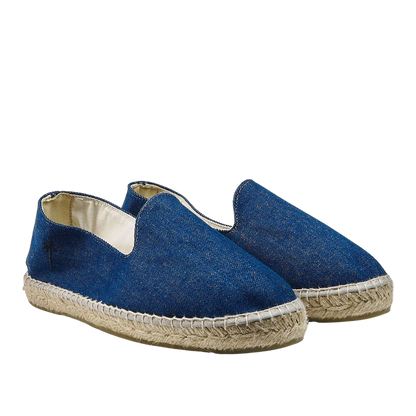 A pair of Dark Jeans San Francisco Denim Espadrilles by Manebi on a white background.