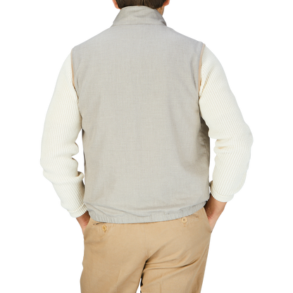 The man is wearing a Manto Beige Reversible Loro Piana Cashpima Gilet and tan pants.