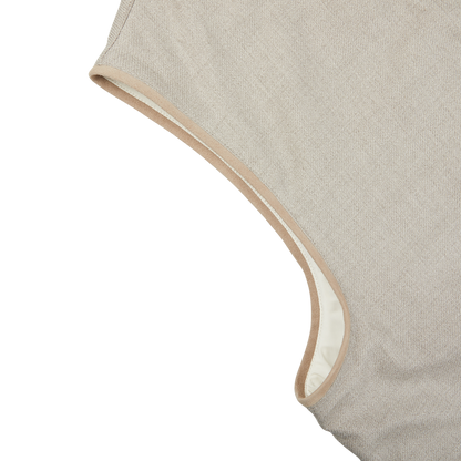 A close up of a Beige Reversible Loro Piana Cashpima Gilet with a beige trim, reversible for extra versatility by Manto.
