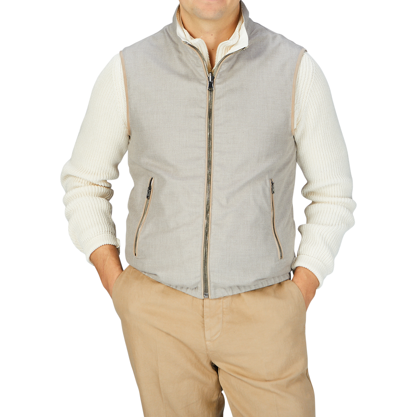 A man wearing a Manto Beige Reversible Loro Piana Cashpima Gilet and khaki pants.