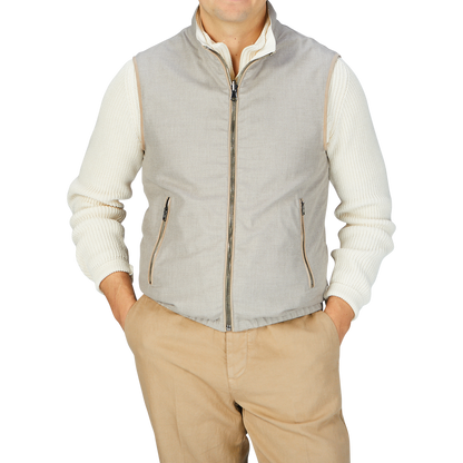 A man wearing a Manto Beige Reversible Loro Piana Cashpima Gilet and khaki pants.