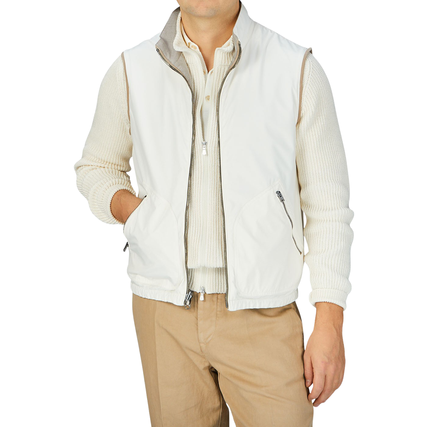 A man wearing a Beige Reversible Loro Piana Cashpima Gilet and tan pants by Manto.