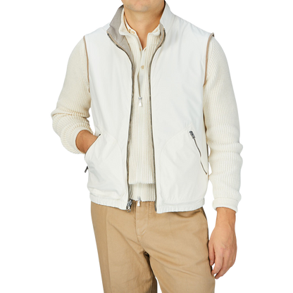 A man wearing a Beige Reversible Loro Piana Cashpima Gilet and tan pants by Manto.