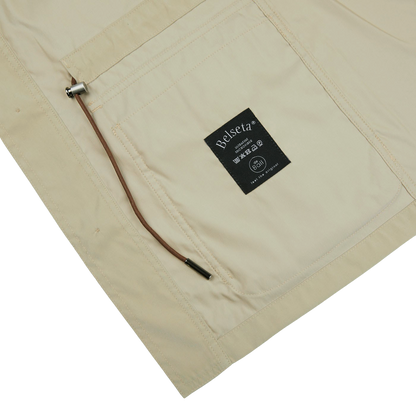 The Khaki Beige Ultrafine Microfiber Safari Jacket by Manto with a black label.