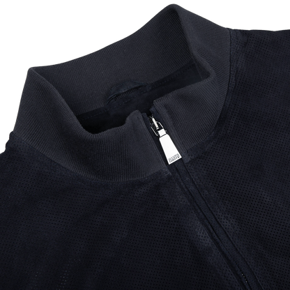 A close up of a Manto navy blue perforated suede leather blouson jacket.