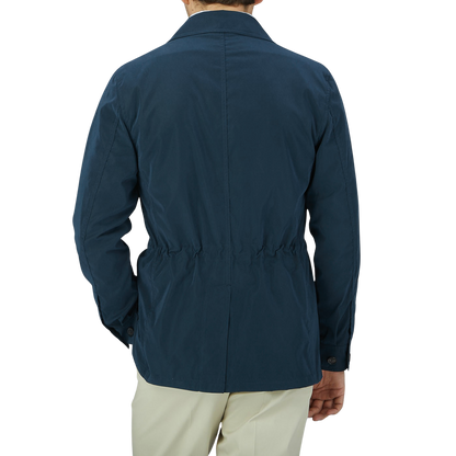The back view of a man wearing a Manto Navy Blue Ultrafine Microfiber Safari Jacket.