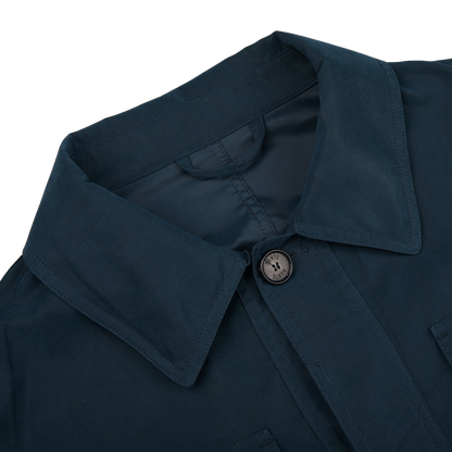 A slim fit Navy Blue Ultrafine Microfiber Safari Jacket with buttons from Manto.