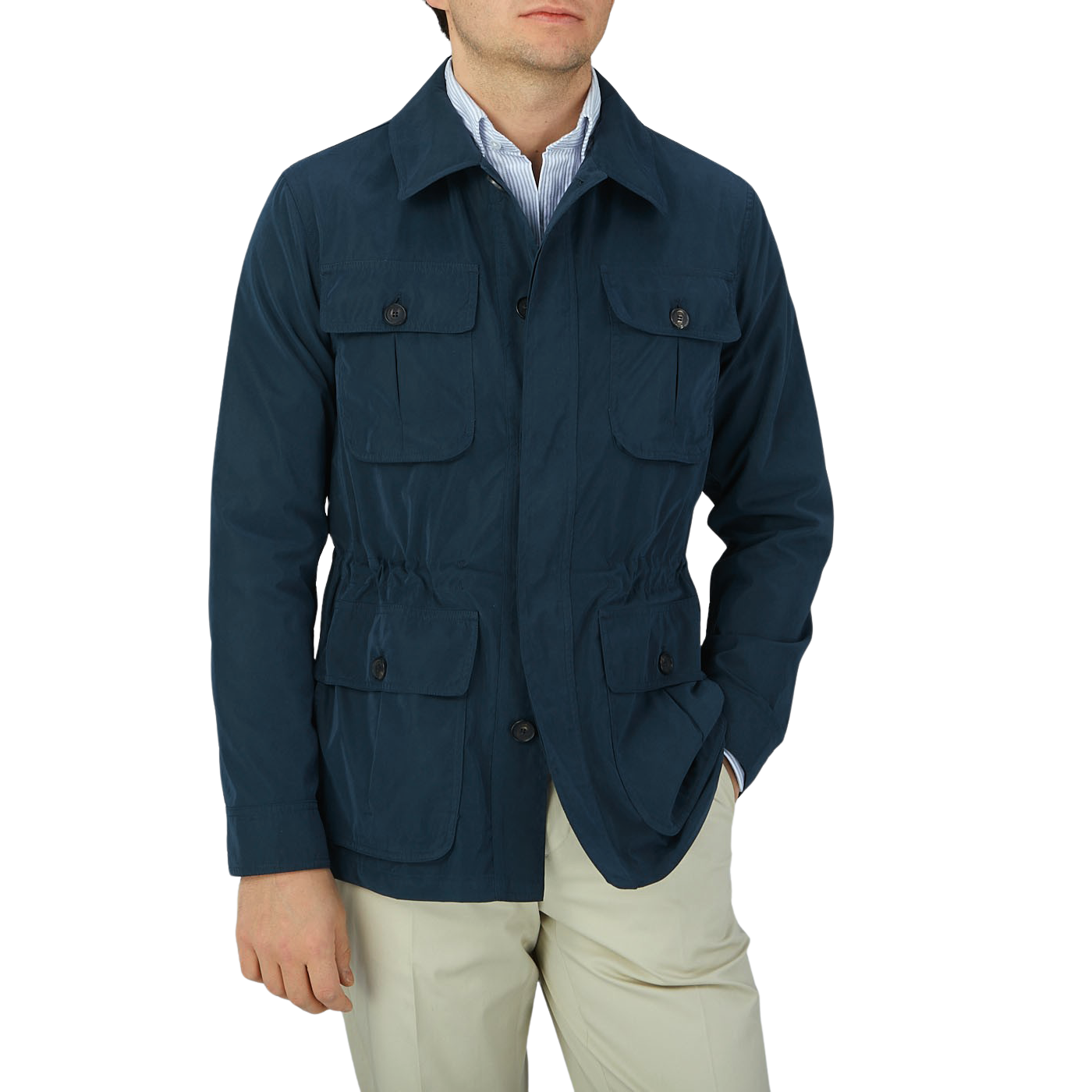 A man wearing a Manto Navy Blue Ultrafine Microfiber Safari Jacket and tan pants.