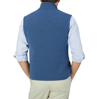 The back view of a man wearing a Maurizio Baldassari Denim Blue Milano Stitch Wool Zip Gilet.