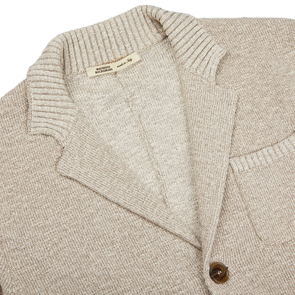 A Maurizio Baldassari Beige Melange Cotton Mouline slim fit knitted jacket with a button down collar.