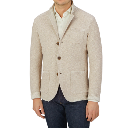 Maurizio Baldassari, a man wearing a Maurizio Baldassari slim fit Beige Melange Cotton Mouline Knitted Jacket and jeans.