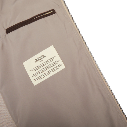 A Maurizio Baldassari Beige Water Repellent Pure Cashmere Gilet with label attached.