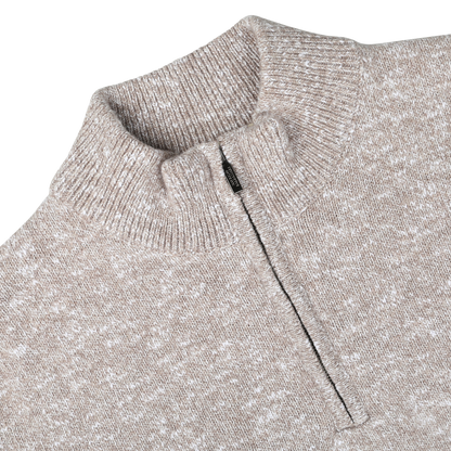Close-up of the Beige Winter Wool Mouline 1/4 Zip Sweater by Maurizio Baldassari, knitted in an oatmeal beige melange from Tasmanian wool, shown against a white background.