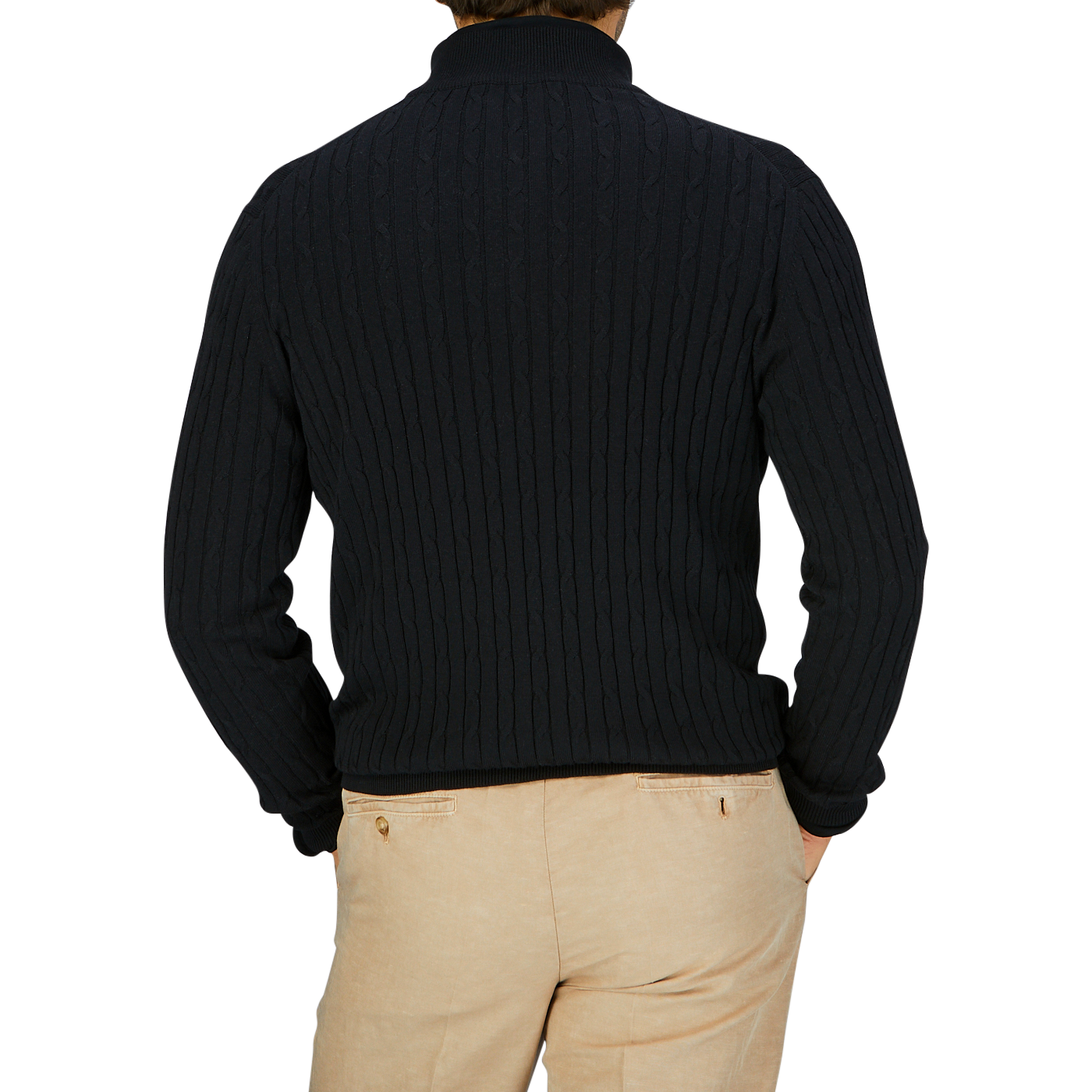 Man wearing a Black Cotton Silk Cable-Knit 1/4 Zip Sweater by Maurizio Baldassari and beige trousers, viewed from the back.