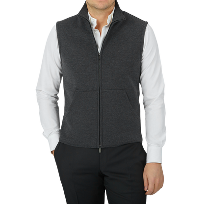 A man wearing a Charcoal Grey Maurizio Baldassari Milano Stitch Wool Zip Gilet and a black shirt.
