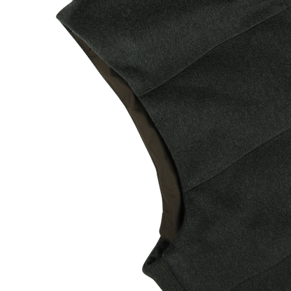 Close-up of the dark green Maurizio Baldassari Water Repellent Cashmere Gilet on a white background, highlighting part of the shoulder and armhole area.