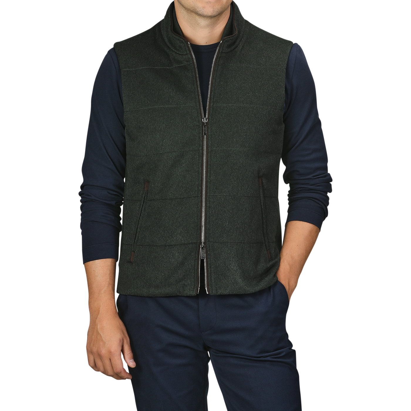 A person wearing a Maurizio Baldassari Dark Green Water Repellent Cashmere Gilet over a navy long-sleeve shirt with dark pants.
